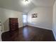 Spacious bedroom with hardwood floors and vaulted ceiling at 965 Mulberry Bay Dr, Dacula, GA 30019