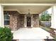 Inviting front porch with brick facade and landscaping at 965 Mulberry Bay Dr, Dacula, GA 30019