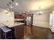 Open kitchen with island, stainless steel appliances, and hardwood floors at 965 Mulberry Bay Dr, Dacula, GA 30019