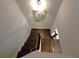 Elegant staircase with dark wood railings at 965 Mulberry Bay Dr, Dacula, GA 30019