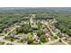 Aerial view of a neighborhood with treelined streets, large manicured lawns, and beautifully landscaped homes at 3215 Kylee Dawn Cir, Lawrenceville, GA 30045