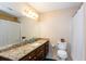 Bathroom with granite countertop vanity, sink, and shower at 3736 Bloxham Ct, Atlanta, GA 30341