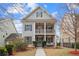 Two-story house with gray siding, front porch, and landscaping at 1968 Perry Nw Blvd, Atlanta, GA 30318