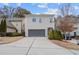 Two-story home with attached garage and driveway at 1968 Perry Nw Blvd, Atlanta, GA 30318