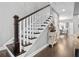 Elegant staircase with dark wood railing and white spindles at 1968 Perry Nw Blvd, Atlanta, GA 30318