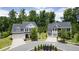 Two story homes with gray roofs and white and gray siding in a neighborhood at 3065 Barnes Mill Ct, Roswell, GA 30075