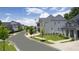 White two-story house with black shutters and a metal roof in a neighborhood at 3065 Barnes Mill Ct, Roswell, GA 30075