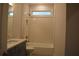 Updated bathroom features a modern vanity, a bathtub, and stylish tile at 3065 Barnes Mill Ct, Roswell, GA 30075