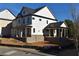 Two-story home with gray roof, white siding, and a covered porch at 3065 Barnes Mill Ct, Roswell, GA 30075