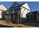 Two-story house with white siding, dark shutters, and a two-car garage at 3065 Barnes Mill Ct, Roswell, GA 30075