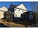 Two-story house with white siding, gray roof, and a covered porch at 3065 Barnes Mill Ct, Roswell, GA 30075