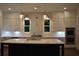 Kitchen with white cabinets, quartz countertops, and an island at 3065 Barnes Mill Ct, Roswell, GA 30075