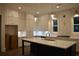 Kitchen with white cabinets, quartz countertops, and island at 3065 Barnes Mill Ct, Roswell, GA 30075