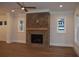 Living room with hardwood floors and a brick fireplace at 3065 Barnes Mill Ct, Roswell, GA 30075