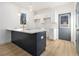 Modern kitchen with a large island and white cabinets at 935 Smith Sw St, Atlanta, GA 30310