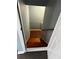 Basement stairs with dark wood steps and gray walls at 700 Somerset Vale Dr, Lawrenceville, GA 30044