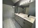 Updated bathroom, featuring a double vanity and a large walk-in shower at 700 Somerset Vale Dr, Lawrenceville, GA 30044