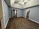 Bedroom with dark flooring, ceiling fan and access to hallway and closet at 700 Somerset Vale Dr, Lawrenceville, GA 30044