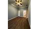 Bedroom with dark wood floors and an ensuite bathroom at 700 Somerset Vale Dr, Lawrenceville, GA 30044