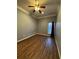 Bright bedroom featuring dark wood flooring and a window with drapes at 700 Somerset Vale Dr, Lawrenceville, GA 30044