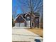 Brick house with two-car garage and landscaped yard at 700 Somerset Vale Dr, Lawrenceville, GA 30044