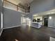 Two-story Gathering room featuring hardwood floors, a fireplace, and plenty of natural light at 700 Somerset Vale Dr, Lawrenceville, GA 30044