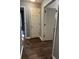 Hallway with dark flooring and neutral-colored walls at 700 Somerset Vale Dr, Lawrenceville, GA 30044