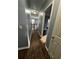 Upper hallway with dark flooring and access to bedrooms at 700 Somerset Vale Dr, Lawrenceville, GA 30044