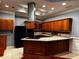 Kitchen with island, wood cabinets, granite counters at 700 Somerset Vale Dr, Lawrenceville, GA 30044
