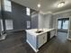 Open floor plan with a modern kitchen and spacious Gathering room with high ceilings at 700 Somerset Vale Dr, Lawrenceville, GA 30044
