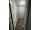 Convenient laundry room with ample shelving and dark gray flooring at 700 Somerset Vale Dr, Lawrenceville, GA 30044
