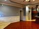 Living room with tile floor and wainscoting at 700 Somerset Vale Dr, Lawrenceville, GA 30044