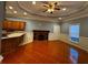 Open living room with kitchen island, fireplace, and tile floors at 700 Somerset Vale Dr, Lawrenceville, GA 30044