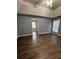 Spacious main bedroom with hardwood floors and ceiling fan at 700 Somerset Vale Dr, Lawrenceville, GA 30044