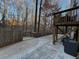 Large concrete patio adjacent to deck, offering ample outdoor space at 700 Somerset Vale Dr, Lawrenceville, GA 30044