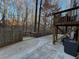 Large concrete patio with deck and wooded views at 700 Somerset Vale Dr, Lawrenceville, GA 30044