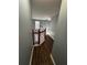 Upstairs hallway with dark wood floors and gray walls at 700 Somerset Vale Dr, Lawrenceville, GA 30044