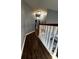 Upstairs hallway with dark wood flooring and railing at 700 Somerset Vale Dr, Lawrenceville, GA 30044