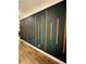 Modern accent wall with vertical wood details in a hallway at 1706 Pardee Dr, Kennesaw, GA 30152