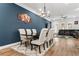 Elegant dining room with a dark table, chandelier, and blue accent wall at 1706 Pardee Dr, Kennesaw, GA 30152