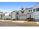 Row of townhouses featuring white and gray exteriors and attached garages at 1706 Pardee Dr, Kennesaw, GA 30152