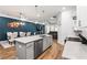 Modern kitchen with gray island, stainless steel appliances, and white cabinets at 1706 Pardee Dr, Kennesaw, GA 30152