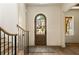 Bright entryway with an arched door, hardwood floors, and a stylish rug at 6055 Tattnall Overlook, Acworth, GA 30101