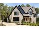 Brick house with a stylish dark roof and black windows at 6055 Tattnall Overlook, Acworth, GA 30101