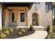 Covered front porch with stone flooring and wooden beams at 6055 Tattnall Overlook, Acworth, GA 30101