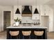 Modern kitchen with white cabinets, a large island, and stylish pendant lights at 6055 Tattnall Overlook, Acworth, GA 30101