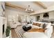 Open-concept living room with sectional sofa, coffee table, and a view into the kitchen at 6055 Tattnall Overlook, Acworth, GA 30101