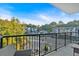 Private balcony with city views and outdoor seating at 6890 Peachtree Dunwoody Rd # 303, Atlanta, GA 30328