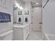Bathroom features a single sink vanity with stone countertop, shower, and toilet at 6890 Peachtree Dunwoody Rd # 303, Atlanta, GA 30328