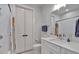 Bathroom features a double sink vanity with stone countertop, shower, and toilet at 6890 Peachtree Dunwoody Rd # 303, Atlanta, GA 30328